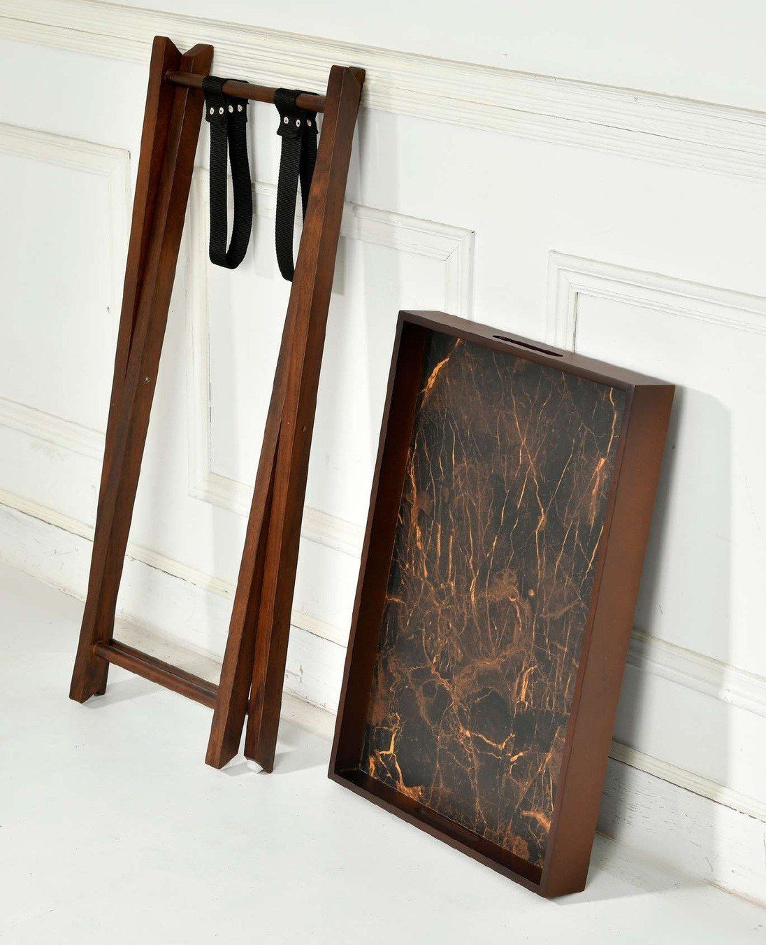 Butler table folded flat with the tray top leaning beside it