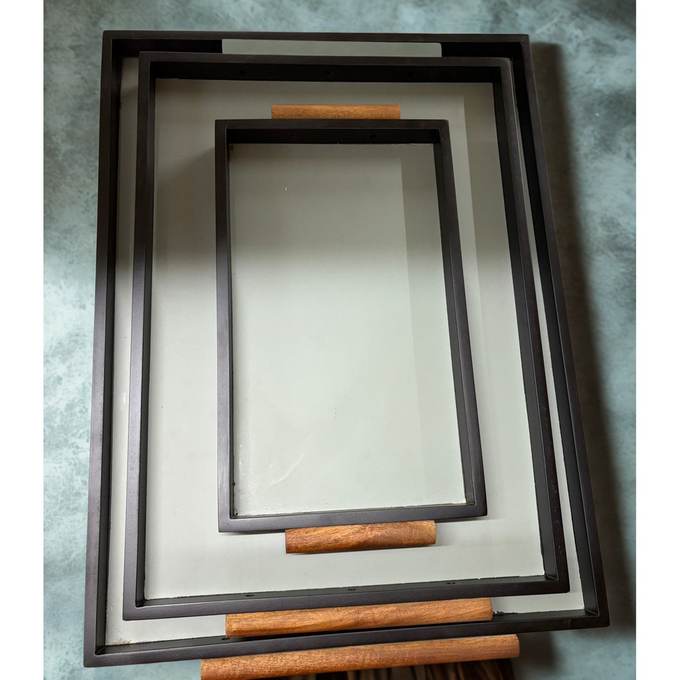 Set of three wooden trays